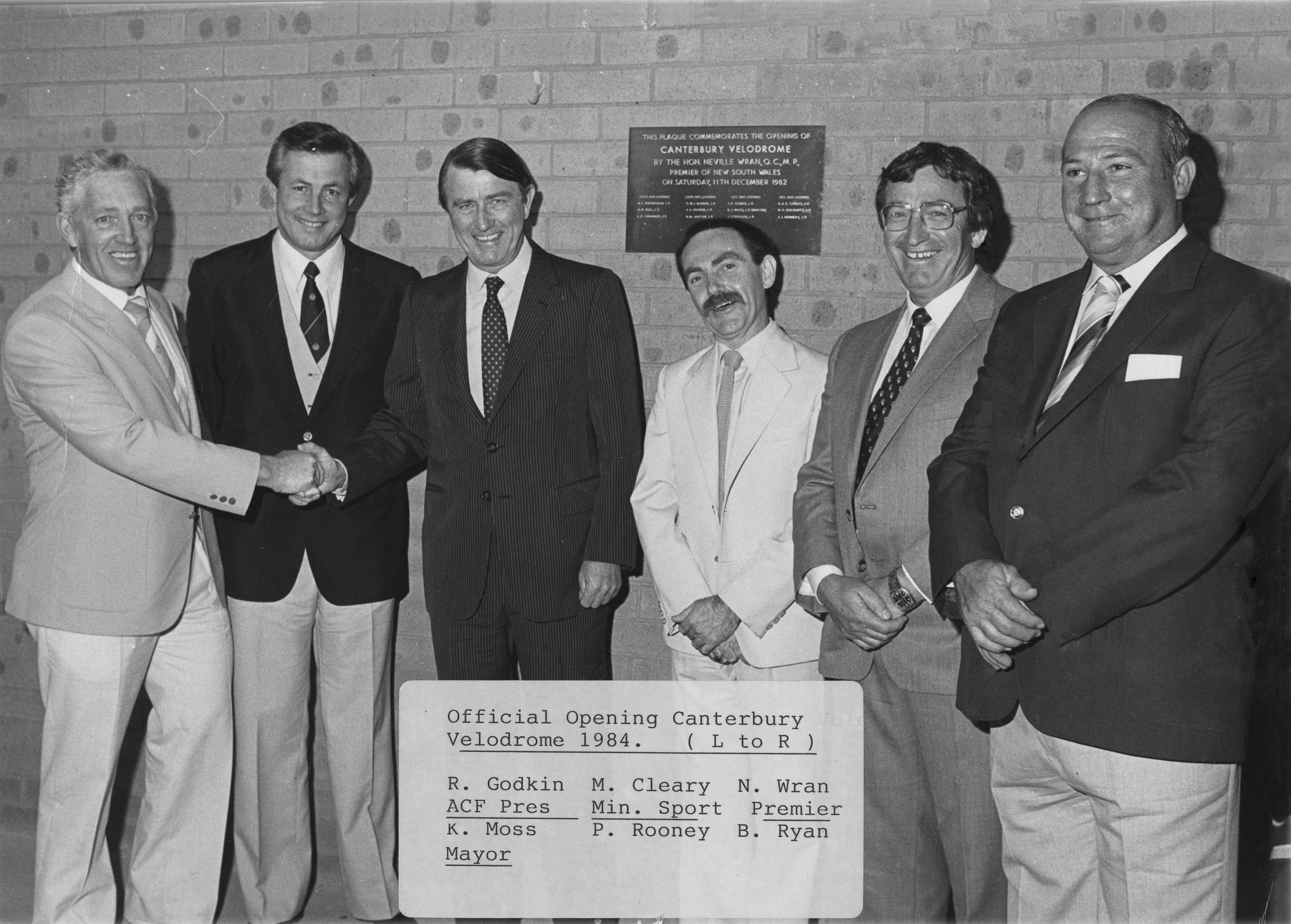 Ray Godkin (far left) shakes hands with Neville Wran at the opening of the Canterbury Velodrome in Sydney, then Premier of New South Wales, in 1984